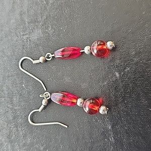 Red beads and silver dangle earrings